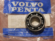 Ball bearing with Volvo Penta packaging on a brown surface